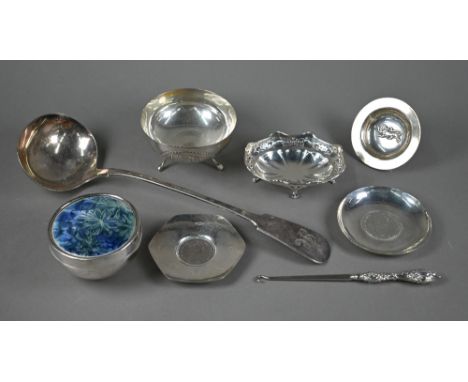 A silver pin-dish set with a 1972 Silver Wedding crown, to/ an unmarked white metal dish set with a 1789 Maria Theresa thaler