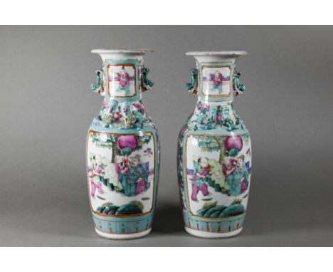 A pair of 19th century Chinese Canton famille rose vases of baluster form with everted foliate rims, applied guardian lions a