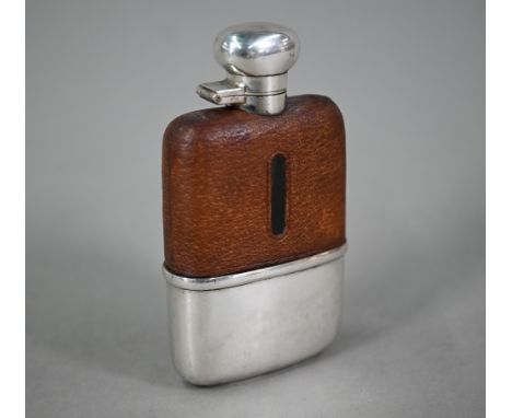 A hip-flask with hinged silver top, leather cover and detachable silver beaker, Hubert Hall, Birmingham 1929 