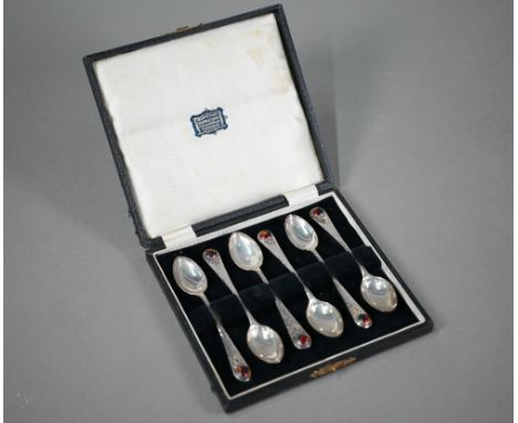 Langstone Silverworks (Bernard Instone): a set of six planished silver teaspoons with enamel boss finials and twisted wire mo