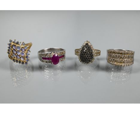 Four various stone-set cluster rings, one 9ct white gold set diamonds, size S, one white metal stamped 18k and 750 set ruby a