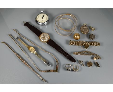 A collection of gold jewellery and other items including a 9ct gatelink bracelet with padlock attached, three yellow metal ba