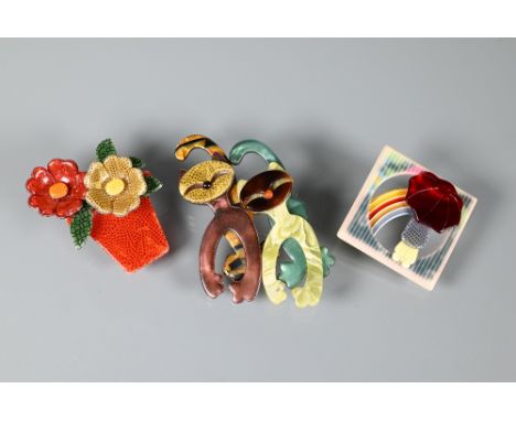 Lea Stein, Paris - Three brooches in multi-colours modelled as two walking cats, 7 x 4.5 cm; a flower pot with two flowers, 5