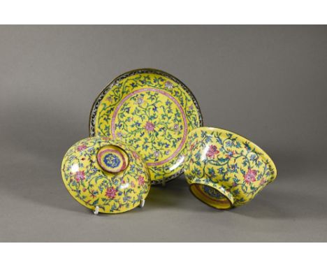 A Chinese Canton enamel yellow-ground bowl, cover and stand, Qianlong period (1736-95) Qing dynasty, finely decorated in poly