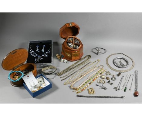 A large assortment of vintage and later costume jewellery including necklaces, enamel badges, brooches etc 