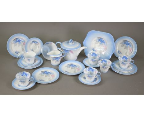 An Art Deco Shelley china tea service, printed and painted with the 'Phlox' pattern within blue border, comprising teapot, mi