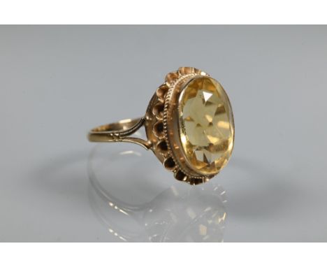 An oval citrine ring set 9ct yellow gold with rope and scallop edge setting, size R 1/2 