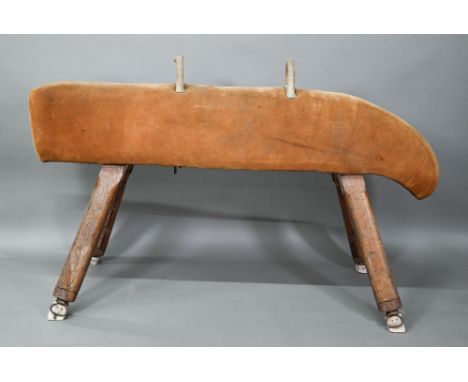 A vintage suede covered gymnasium vault horse, rasied on square adjustable legs - a/f