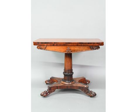 A Victorian rosewood card table, the fold over top enclosing a circular green baize surface, raised on a part moulded column 