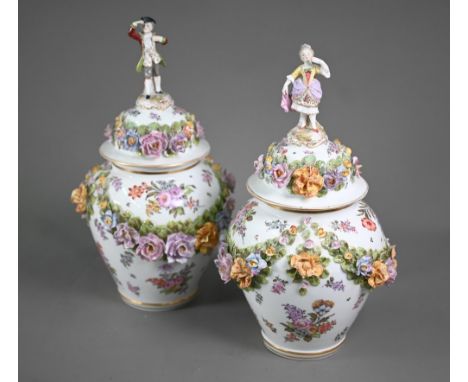 A good pair of German porcelain vases, the domed covers surmounted by an 18th century lady and gentleman dancing, the bodies 