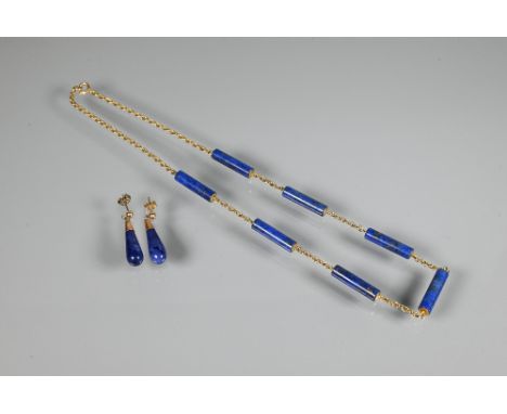 A necklace formed of seven cylindrical lapis lazuli beads on yellow metal double link chain, stamped 9ct to/w pair of lapis l