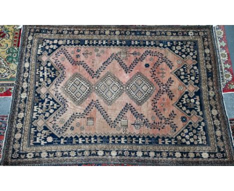 An old North-West Persian kelleh rug, the red ground with stylised garden design, 270 cm x 150 cm 