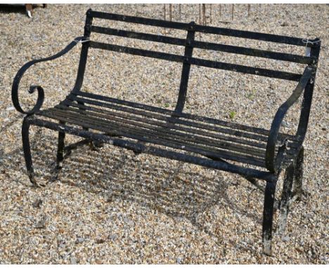 An antique black-painted wrought iron strap-work bench, 124 cm wide 
