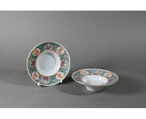 Two Chinese Munshou ware famille rose cup stands/saucers painted in polychrome enamels with lotus scroll on turqouise ground 