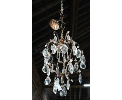 A gilt metal framed large crystal hung single light fitting, with ceiling fitting, approx. 60 cm x 33 cm dia.