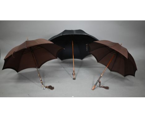 A lady's vintage umbrella by Kendal, with brown silk canopy on rosewood handle with gilt metal mounts and facetted glass pomm