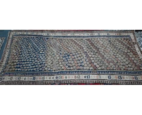 A vintage Turkish kelim carpet, the geometric design in multi-colours, soft overall, 384 cm x 170 cm 