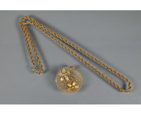 A yellow metal rope twist chain, 30 cm long (closed) to/w a yellow metal mesh disc pendant with two flowers attached stamped 