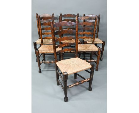 A set of six Lancashire oak framed rope seat chairs, with wavy ladder backs (6) 