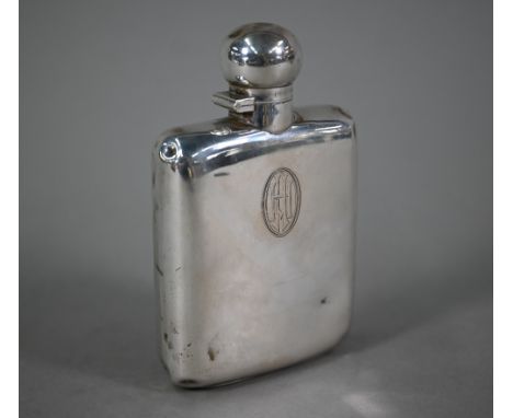 A silver hip flask, the hinged bun cover with bayonet closure, Goldsmiths &amp; Silversmiths Co. Ltd, Sheffield 1928, 6oz, 15