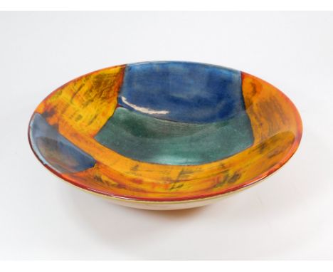 POOLE POTTERY. A Poole Pottery 'Volcano' pattern deep bowl. Printed Poole mark, on orange ground. Diameter 34cm. Height 9cm. 