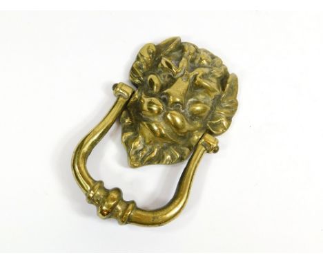 DOOR KNOCKER. A cast brass door knocker. Length 19cm.  Please note that all items in this auction are previously owned & are 