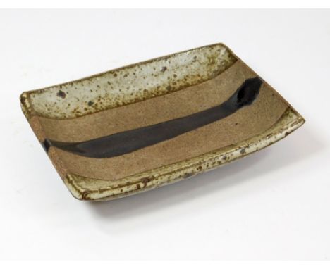 JANET LEACH. A rectangular dish on four feet by Janet Leach. Impressed personal & Leach Pottery marks. 11.5 x 15.5cm.  Please