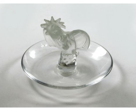 LALIQUE. A Lalique cockerel moulded glass pin tray. Etched Lalique, France mark. (Some minor loss to comb). Diameter 9.2cm.  