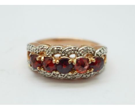 A silver gilt and garnet ring, R 