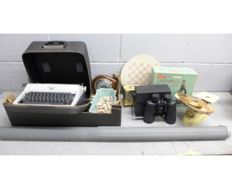 An Olympia Monica typewriter, a Merit microscope set, a pair of 10x50 binoculars, an Estyma quartz clock, a horseshoe shaped 