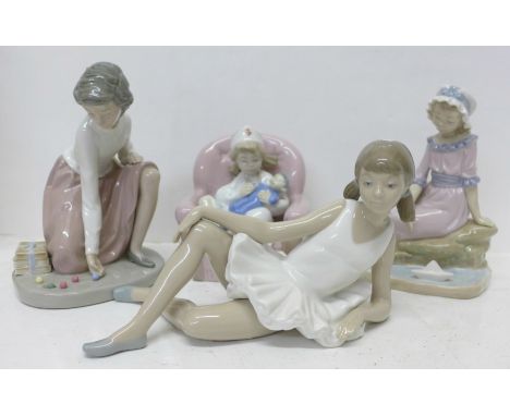 Four Nao by Lladro figures, ?Reclined Ballet? (ref 02000150) boxed, ?Sailing Time? (ref 02000409), ?Playing Nurse? (ref 02001