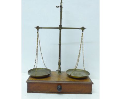A mahogany and brass set of balance scales 