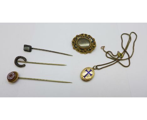 A collection of jewellery including a mourning brooch with inscription, a yellow metal and enamel pendant on chain and three 