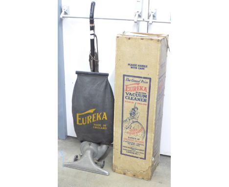 A vintage 1920's Eureka vacuum cleaner, with original box 