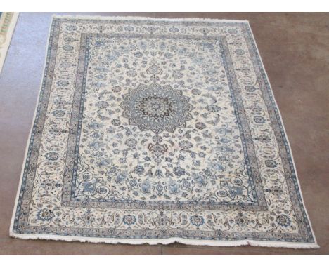 A large bordered Persian Carpet with palmette and leafage scroll design in blue etc on a beige ground, approx 12ft x 9ft