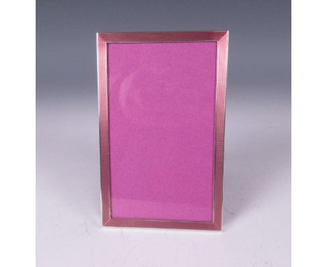 An Elizabeth II silver Photograph Frame with pink basse taille enamel frieze, Birmingham 1972, 5 1/2 x 3 1/2in