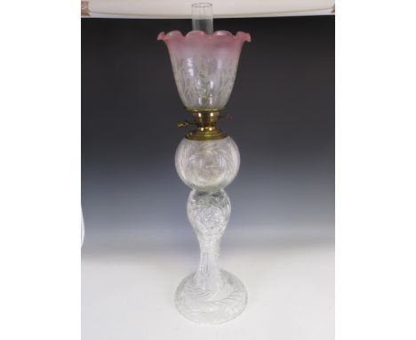 A large cut glass Oil Lamp with brass fittings and engraved shade with red flared rim, 2ft 7in H