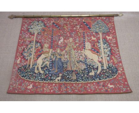 A needlework wall hanging Tapestry in the 14th Century French style depicting noble lady and lady in waiting with rearing lio
