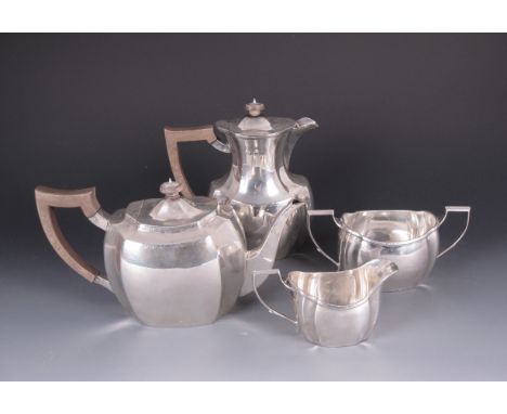 An Edward VIII silver four piece Tea Service of shaped oval form with lightly engraved friezes, Sheffield 1936, maker: Dimmer