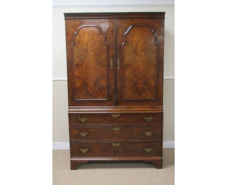 An early 18th Century walnut Cupboard with pair of raised shaped panel doors above three long drawers on bracket feet, 3ft 9i