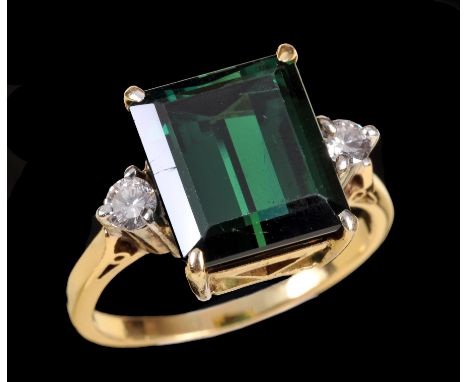 A Green Tourmaline and Diamond Ring corner claw-set step-cut tourmaline between two brilliant-cut diamonds, ring size P