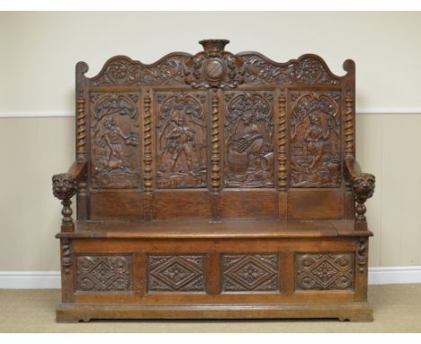 A 19th Century oak Settle, the finely carved four panel back depicting 'Flesh', 'Fowl', 'Wine' and 'Fruit' beneath leafage ca