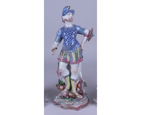 An 18th Century porcelain Figure of Mars, possibly Chelsea, wearing blue-scale cuirass and holding a sword and shield, foliat
