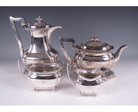 A George V silver six piece Tea and Coffee Service of boat shape engraved bird crest and motto, gadroon rims on bun feet, viz