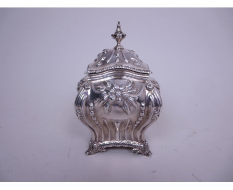 A Victorian Scottish silver Tea Caddy of bombe form with gadroon and flower embossing, scroll feet Edinburgh 1896, maker: Ham