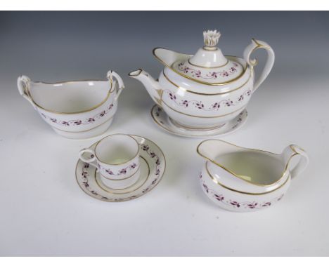 An early 19th Century Worcester Tea and Coffee Service painted puce and gilt trailing leafage frieze, viz: Teapot and Stand, 