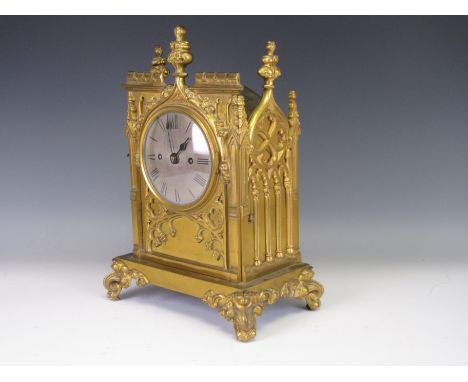 A Gothic style gilt metal repeater Mantel Clock with circular dial inscribed Monk, Bolton with Gothic features to the front a