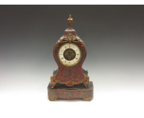 A 19th Century French Boulle Mantel Clock with circular dial and ormolu urn finial and mounts upon a shaped base, A/F, 1ft 4i