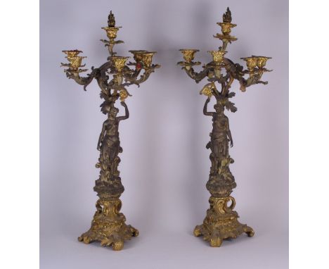 A fine pair of 19th Century mercury gilded five branch Candelabra with acanthus leaf cast branches and sconces above a figure