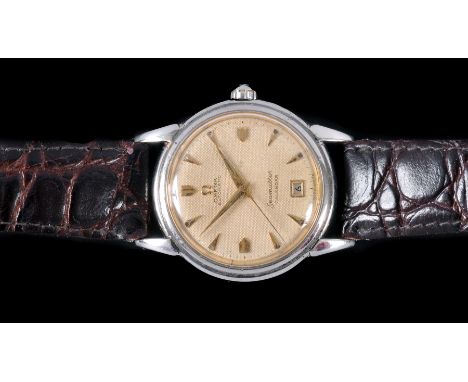 A 1950's/60's Gentleman's Omega Seamaster Calendar Automatic Wristwatch, the champagne dial with hourly chevron markers, swee